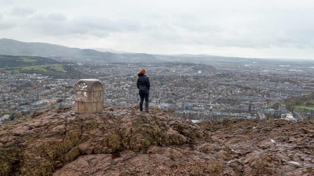 Girl standing atop Arthur's Peak, Edinburgh. 