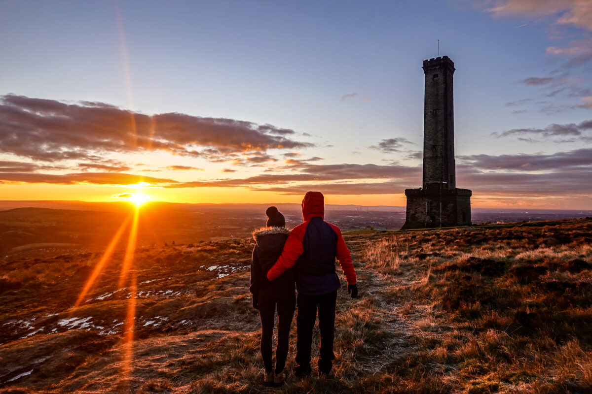 Couple look on at Peel Tower, England