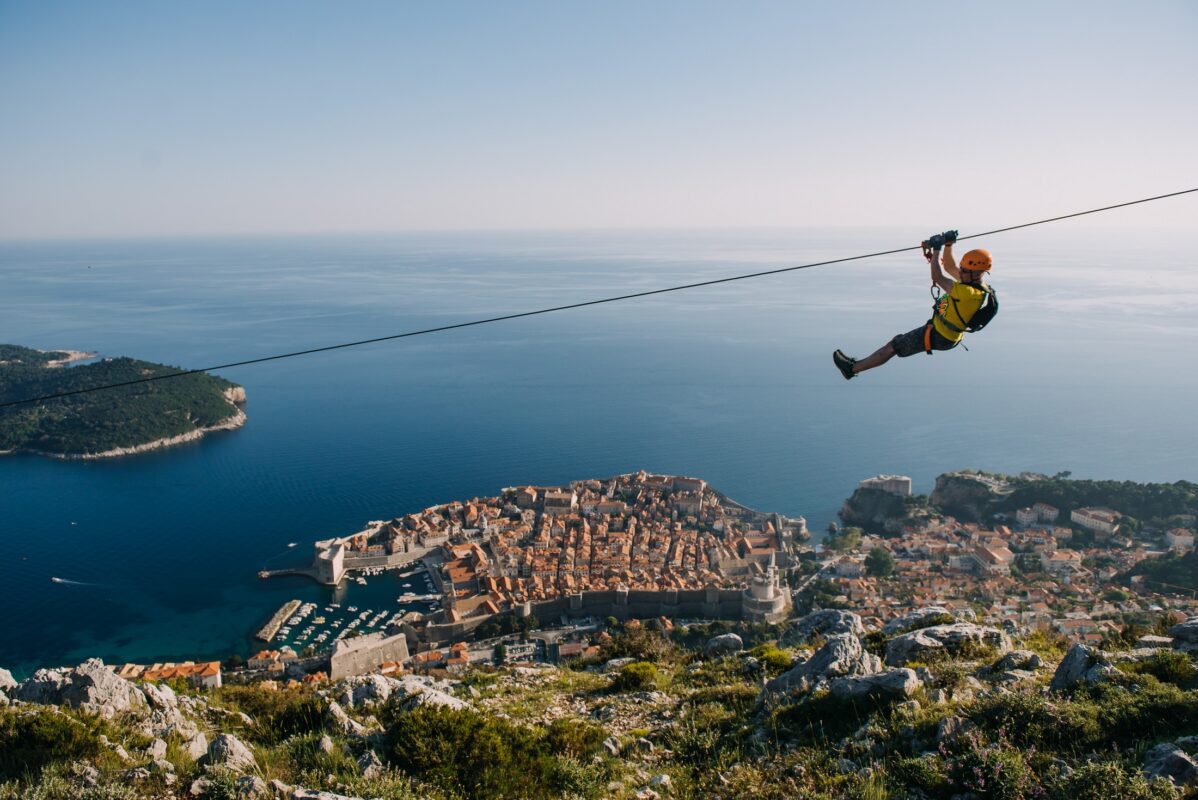 Person ziplining over Dubrovnik